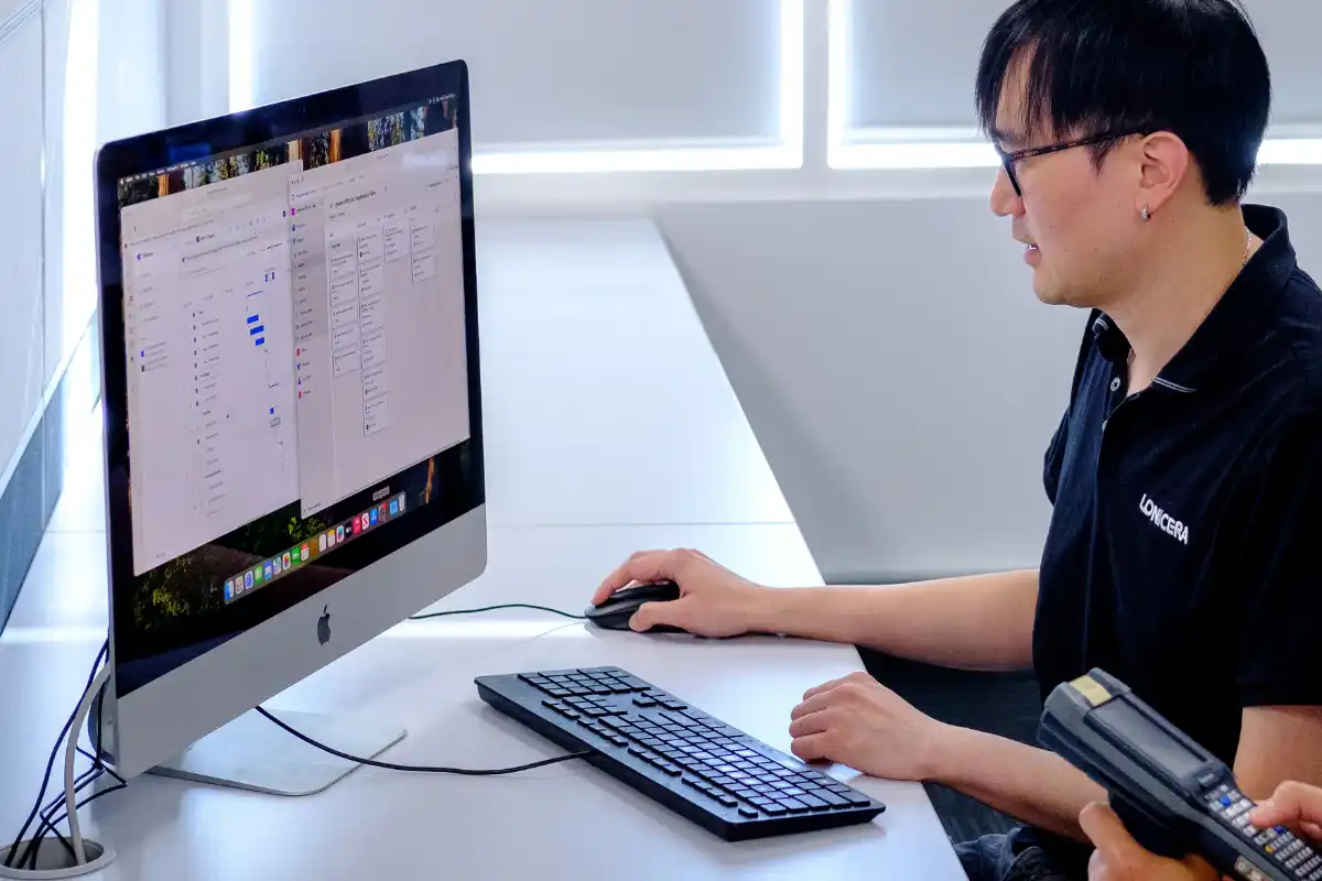 Perry working on data workflow on Apple Mac